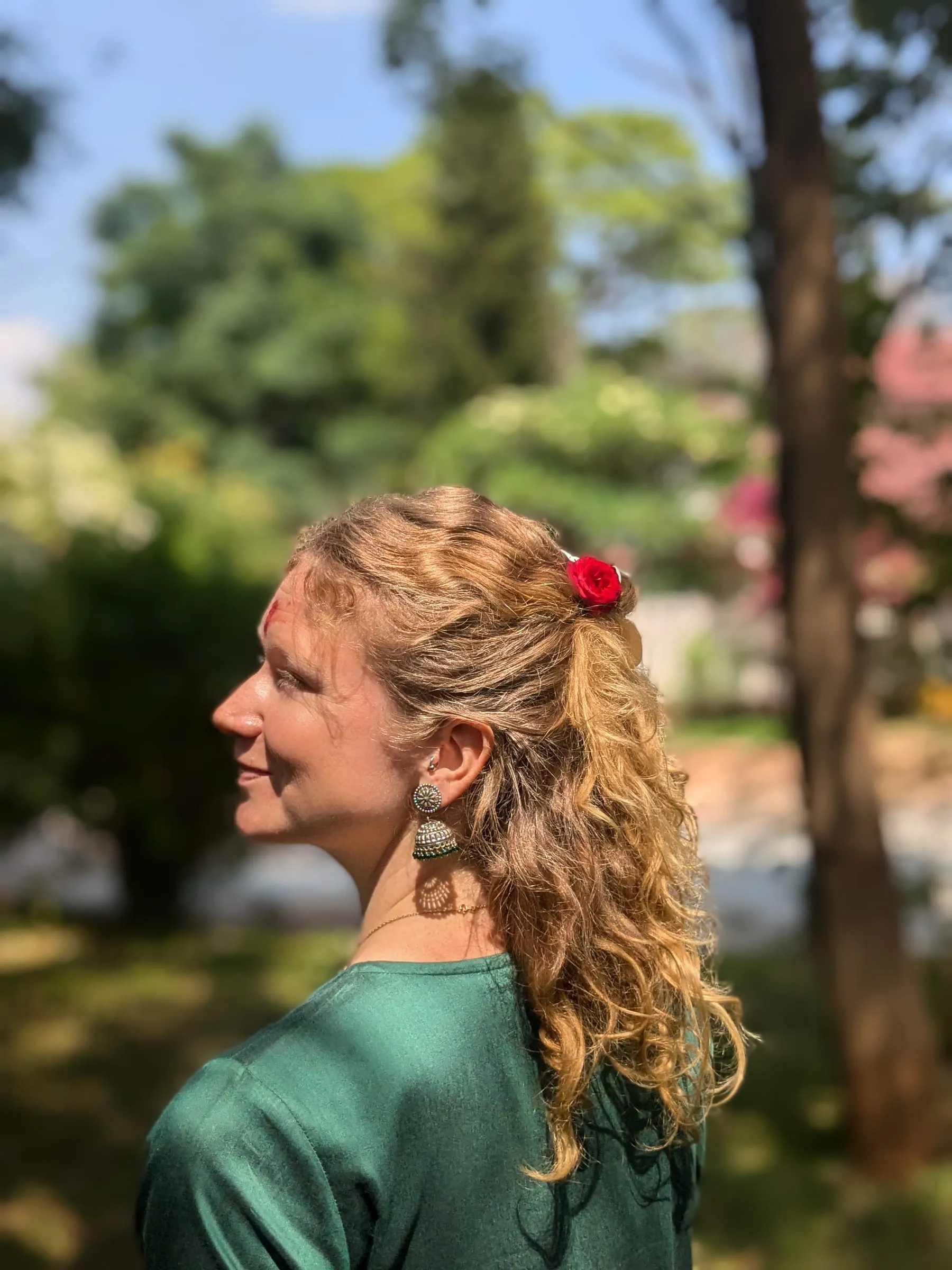 Portrait of Laura in a garden, in natural light